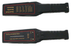 Picture of both sides of the flat control surfaces of two black, hand-held security metal detector, crossing horizontally, shafts to the right.  The top displays the instructions printed in yellow, on the back of the half coil surface. The bottom displays the LED signal indicator bar and two LED spotlights, signals for readiness and alert, framed by a red contour line. The bottom shaft shows a manual emission button at the edge of the control surface, followed by the alert sound trigger.
